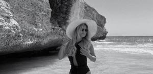 Rising artist and social media influencer Csenge Forstner by the beach.