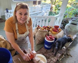 Joanie Wynn harvesting cacao