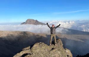 Brandon Heath is pictured after reaching the top of Mt. Kilimanjaro last month.