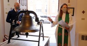 Pastor Brett Wilson (right) rededicates the newly-restored bell at Georgetown Lutheran Church, with National Bell Festival director Paul Ashe (left).