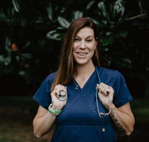 Casey holding a stethoscope around her neck