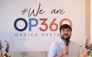 Barranquilla Mayor Jaime Pumarejo speaking to crowd at opening of OP360 offices.