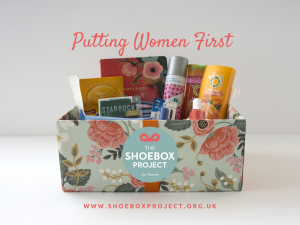 Intro image to the Shoebox Project for Women UK includes image of an gifted shoebox example and the logo