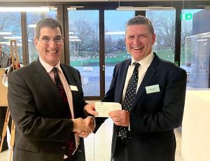 Mark Heasman Handing Over A Cheque Of £135,000 To Vice Chancellor Professor Anthony Forster