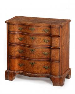 Diminutive George I/II burr elm 'mulberry' serpentine chest of drawers, second quarter 18th century (est. $10,000-$15,000).