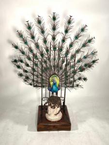 Spectacular Albany of England porcelain, bronze and enamel peacock on a stand, 60 inches tall, the bronze bird brightly glazed ($5,842).