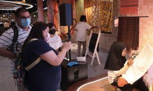 The Enthusiasm of Expo 2020 Dubai Visitors on the All-Exclusive Batik Painting Demonstration at the Indonesia Pavilion