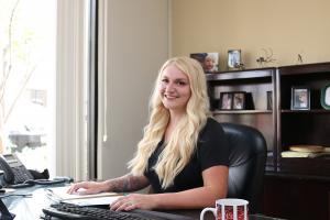 female project manager sitting at a desk in construction office