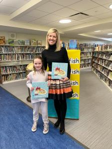 Saint Joseph School second-grader, Jackie Steinkrauss with author, Catherine Corcoran on Read Across America Day