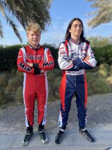 Two racing drivers standing for a portrait