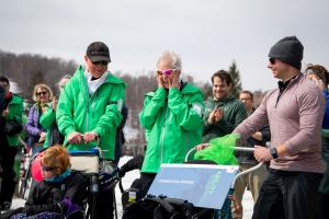 Athlete and her family show reaction of surprise when new grant is announced