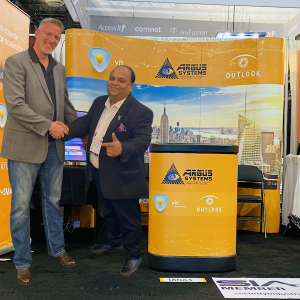 Tom Larson President , Velasea Inc shaking hands with Rohit Khubchandani, CEO of Argus Systems