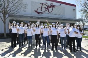 Volunteers gather at Bridge Publications in Commerce, California, and take off to hand out "The Way to Happiness" to all they meet in East Los Angeles.