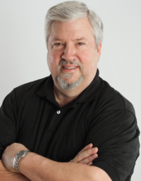 Jere Van Puffelen, Chairman of the Board, PRISM Logistics, arms crossed