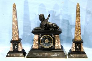 Fine 19th century multi-colored marble and bronze clock and obelisks, highly decorated with hieroglyphics and phoenix birds (est. $3,000-$4,000).