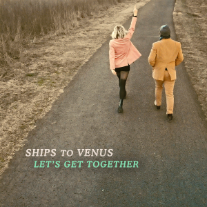 Alyssa Suede and Spaceship walking down a paved road for their music video shoot for "Let's Get Together"