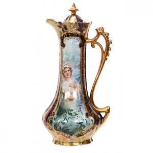 Chocolate pot marked R.S. Prussia in the Rosebud mold, 11 ¾ inches tall, with a keyhole winter scene portrait décor, iridescent Tiffany background ($3,025).