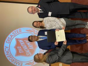 Pat Carnevale (center), Deputy Director of the Massachusetts Emergency Management Agency, with leaders from The Salvation Army Massachusetts Division