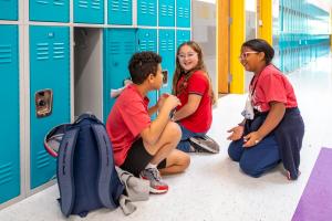 SST Students enjoying downtime and discussing robotics club