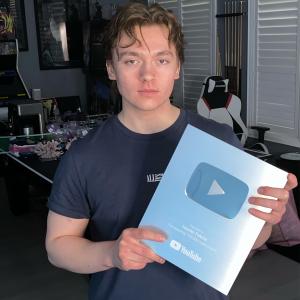 Hunter Fekete with 100K subscriber plaque