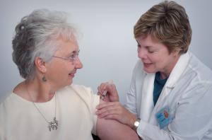 A picture of a doctor working with a patient from the community.