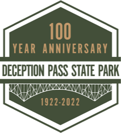 Green hexagon shaped logo with the words 100 Year Anniversary Deception Pass State Park 1922-2022 and a rendered image of the pass