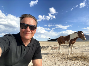 Scott Beckstead on the range with wild Onaqui horses in 2021