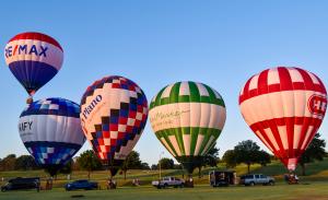 Hot Air Balloons (left to right) RE/MAX, UNIFY, Plano, Central Market and H-E-B at Oak Point Park in Plano, Texas