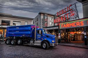 A DTG Roll-Off truck is seen in front of Pike Place Market, Seattle, WA