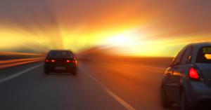 two fleet vehicles driving on California highway