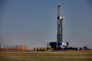Oil drilling rig sitting in a field in Colorado