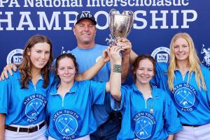 Aiken Girls arena polo team holds championship trophy