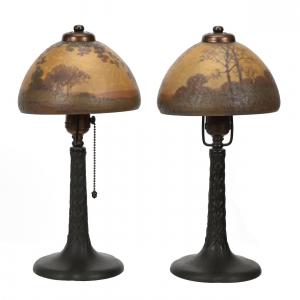 Extra nice pair of signed Handel #6150 boudoir lamps, 14 ½ inches tall, with beautiful reverse painted shades showing spring and fall season decors.