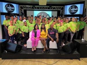 (L to R) Florida Eleventh Judicial Circuit Chief Judge Nushin Sayfie, 99 Jamz personality Brandi Troup, and Bruce Jackson with Embrace Girls Foundation members.