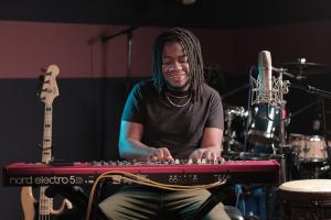 Beneil Miller, Reggae Artist, Pianist, Multi-instrumentalist, Cayman Islands at Piano