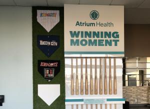 Custom wall display featuring baseball bats, custom bases and plates, and AstroTurf.