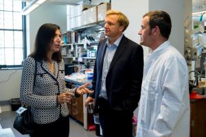 Dimitri Krainc, MD, PhD, and Huda Zoghbi, MD, toured his laboratory during her visit to Northwestern.