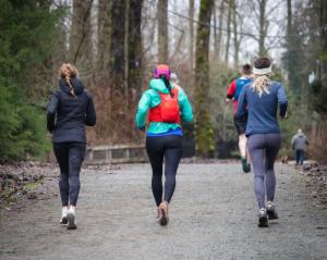 Girls jogging through the woods