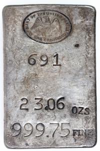 US Mint San Francisco 23.06-ounce silver ingot, 999.75 fine, sizable at 2 ¼ inches by 3 ½ inches, with original Mint patina (est. $5,000-$9,000).