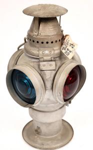 ADLAKE (short for “Adams and Westlake”) non-sweating red and blue lens lamp, 16 inches tall. (est. $200-$300).