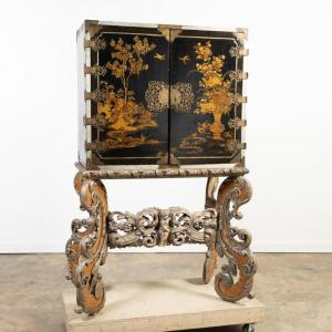 Late 18th/early 19th century William and Mary parcel gilt and black lacquer Japanned cabinet on a stand ($10,625).