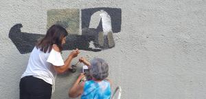 Mural “Prison Without Bars" by Josie Morais and Cidinha in Sao Paulo, Brazil.