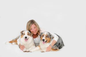 The author and her two Australian Shepherd, Seven and Paige Turner