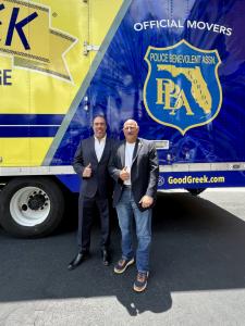 Spero Georgedakis and John Kazanjian Standing in front of custom wrapped FLPBA moving truck