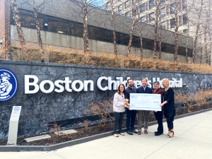 Compass Furnished Apartments $100K Check Signing Event at Boston Children's Hospital in Boston, Massachusetts