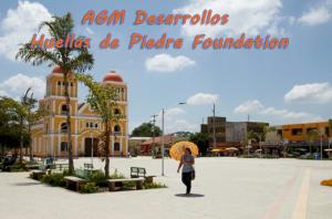 City block of El Carmen de Bolívar Colombia.  Sunny, with a few casual strolling people