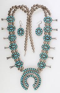 Navajo squash blossom turquoise and coral necklace with matching set of earrings signed by the famous Navajo artist, Victor Moses Begay, circa 1970s-80s ($1,438).