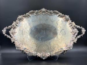 English sterling silver serving tray (London, 1783), rococo handled form with foliate scroll border, weighing 167.7 oz. troy ($4,612).