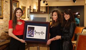 Letter of recognition honoring master craftsmen Frank Frazetta and L. Ron Hubbard presented by Frazetta daughter Holly Frazetta and granddaughter Sara Frazetta.