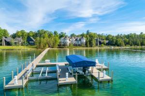 Back View With Dock - Interluxe Auctions: 08425 Raspberry Lane, Charlevoix, MI